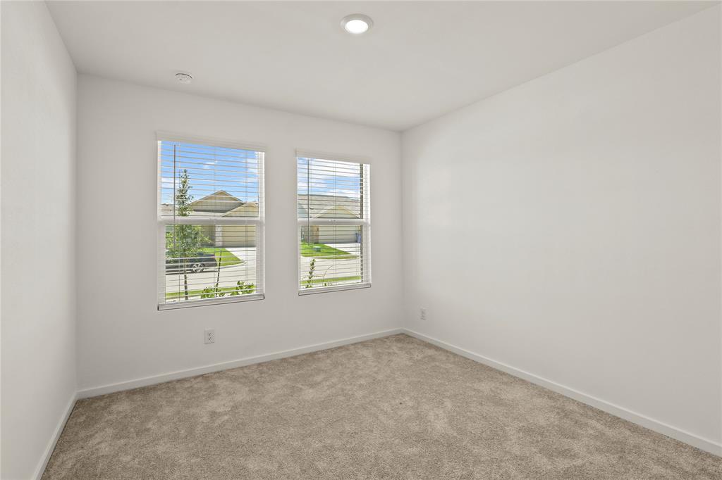 1138 Barbary Flds Street Forney, TX 75126 - Photo 20 of 25 Bedroom with two windows featuring horizontal blinds