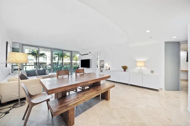 a living room with furniture and white walls