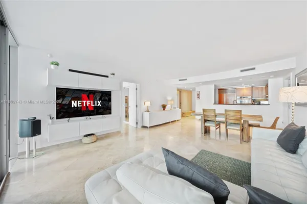 a bedroom with a bed and a lamp