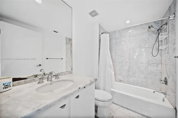 a kitchen with a appliances a sink and cabinets