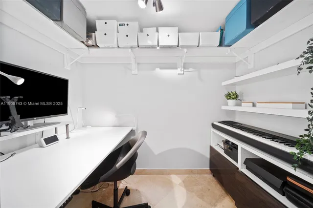 a bed room with a bed and a chair