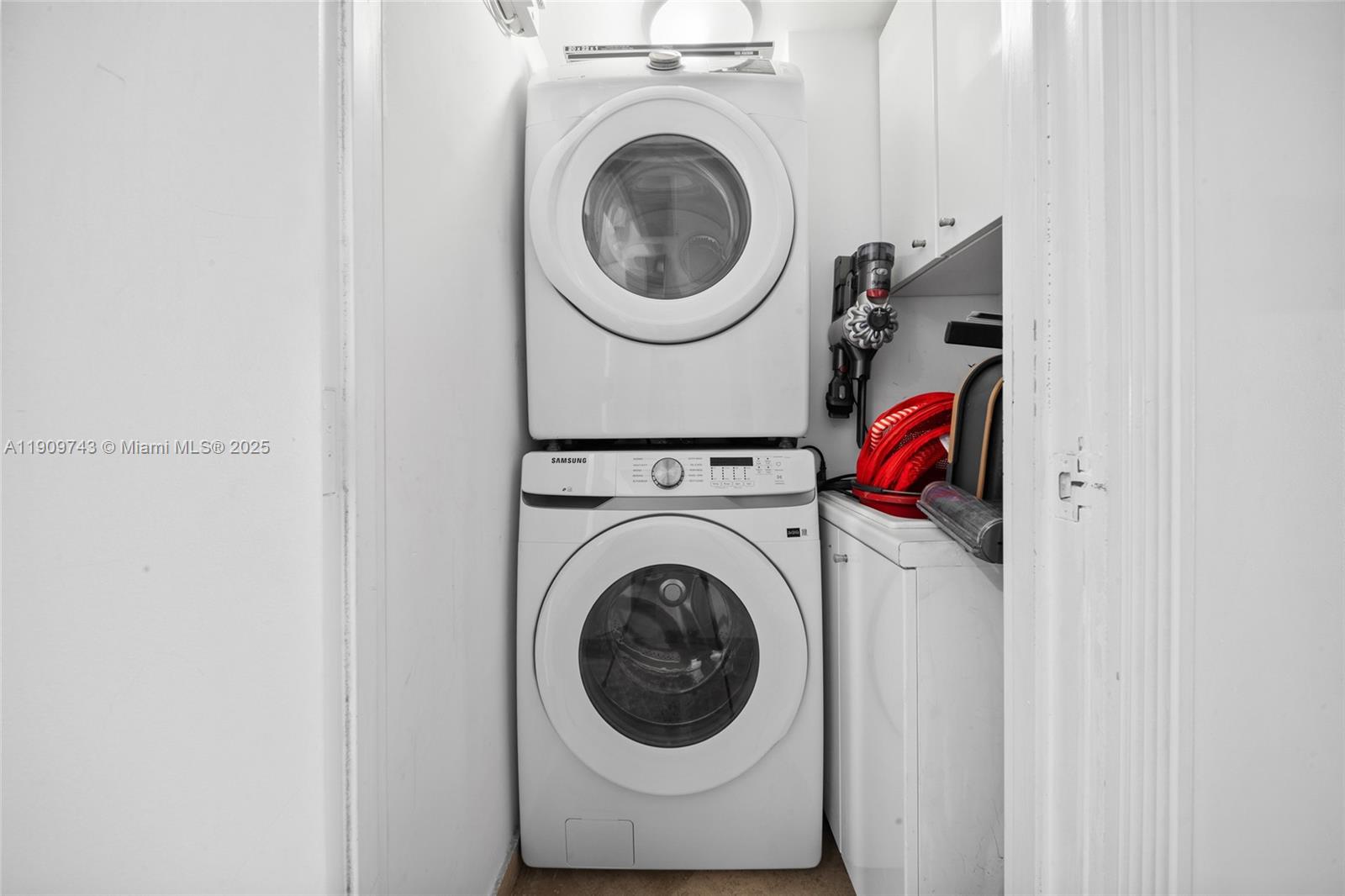 9401 Collins Avenue, Unit 205 Surfside, FL 33154 - Photo 27 of 36 a utility room with dryer and washer