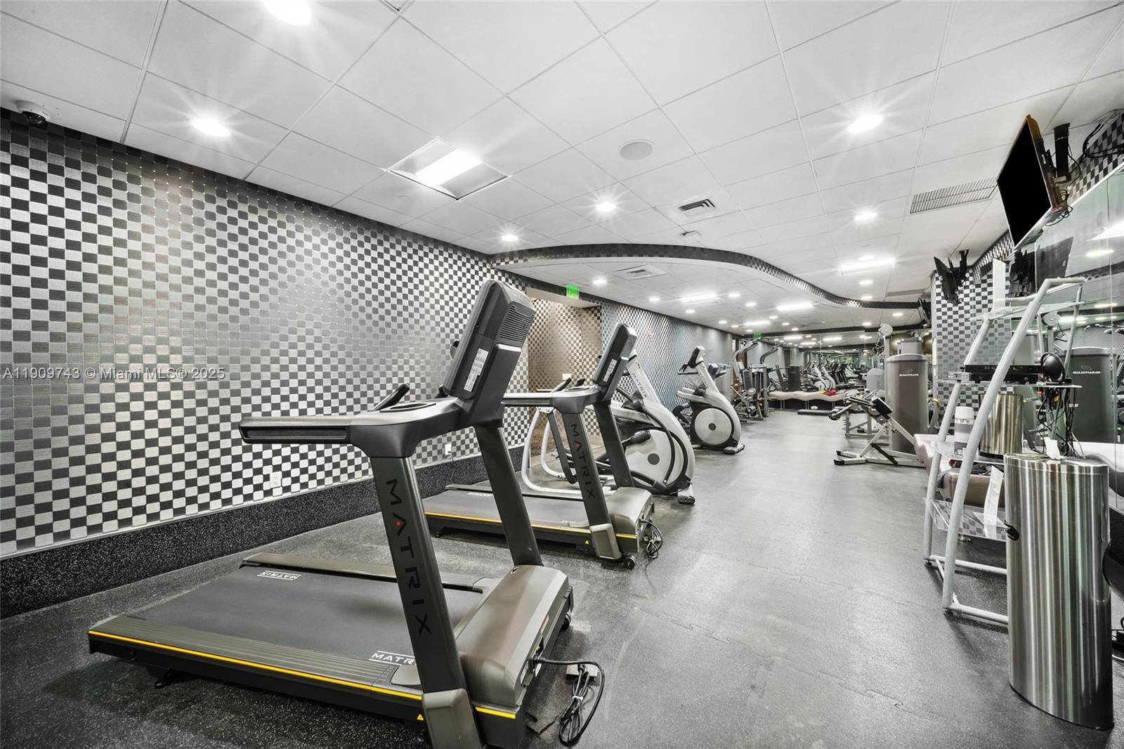 9401 Collins Avenue, Unit 205 Surfside, FL 33154 - Photo 30 of 36 a view of a room with gym equipment