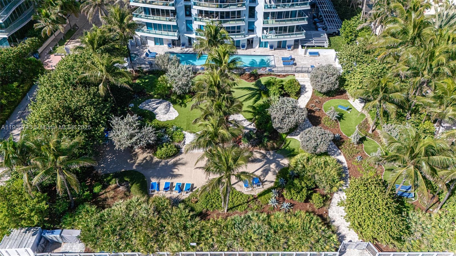 9401 Collins Avenue, Unit 205 Surfside, FL 33154 - Photo 6 of 36 a plant that is in front of a building