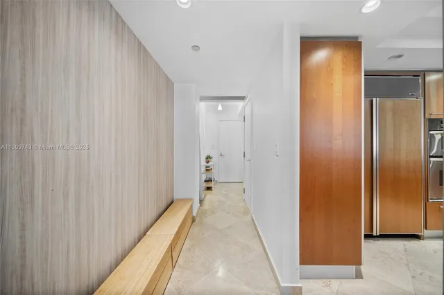 a large kitchen with stainless steel appliances granite countertop a sink and cabinets