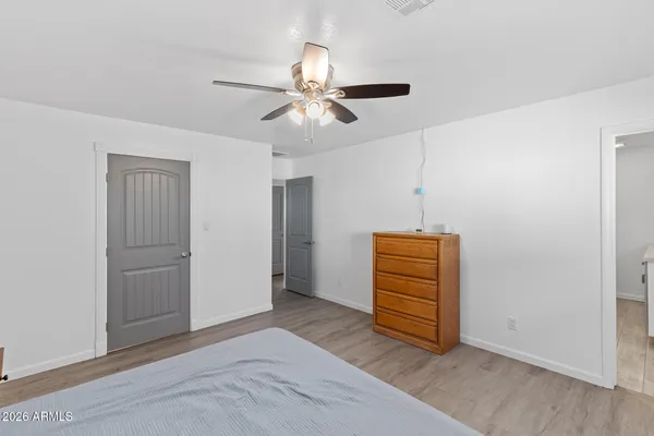 a bedroom with a bed and a table