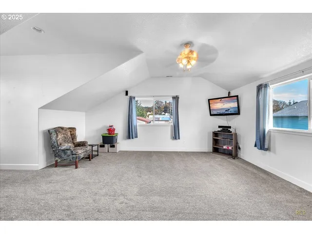 a view of a livingroom with furniture and a garage