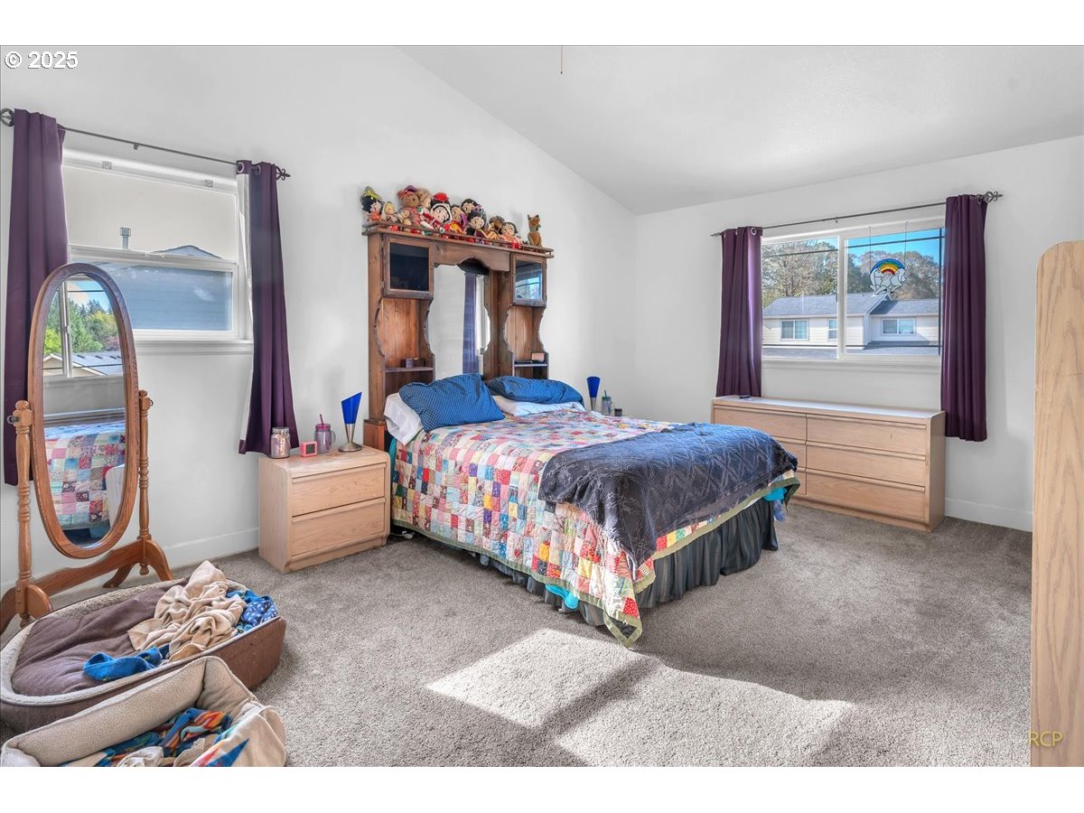 59174 Whitetail Avenue St. Helens, OR 97051 - Photo 22 of 34 a bedroom with a bed and dresser