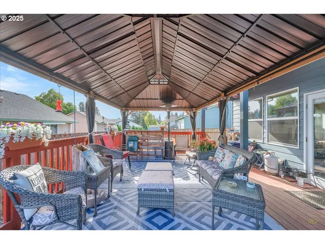 a view of a backyard with sitting area