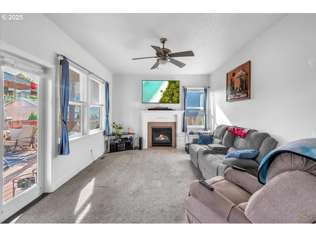 a view of a livingroom with furniture and staircase