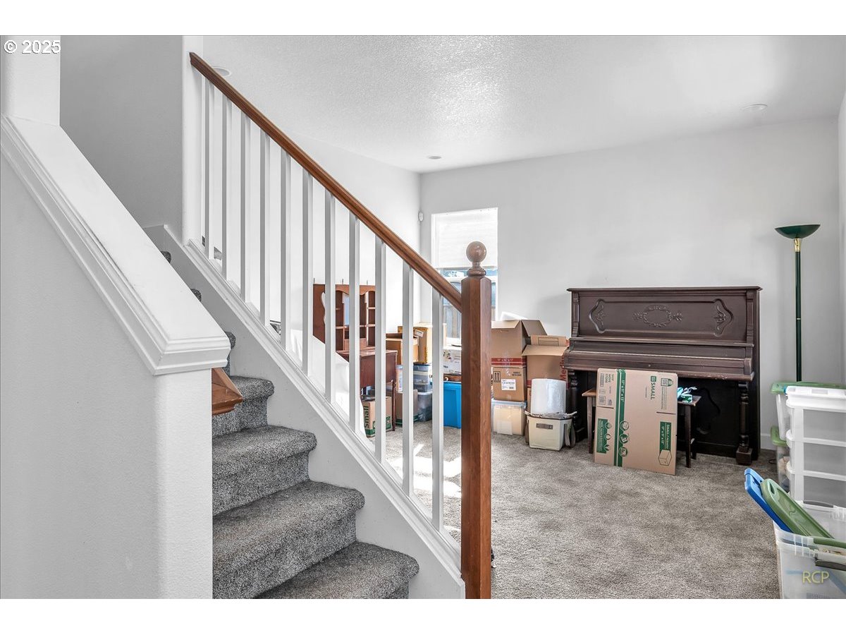 59174 Whitetail Avenue St. Helens, OR 97051 - Photo 7 of 34 a view of a livingroom with furniture and staircase