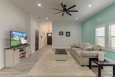 a dining room with furniture and window