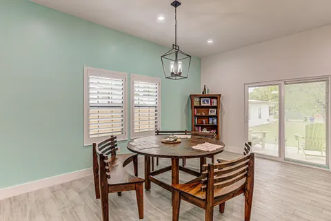 a view of a kitchen and dining room