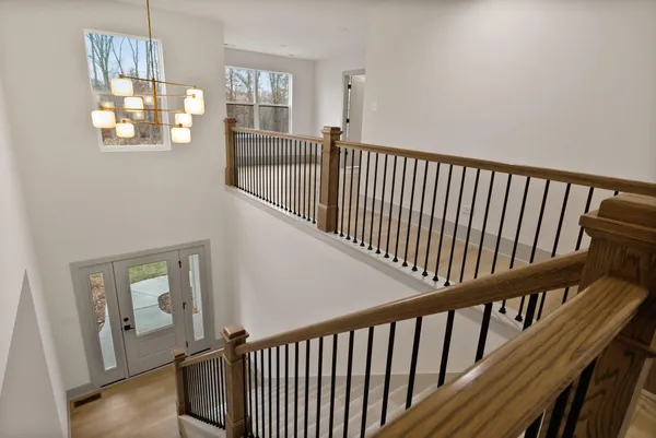 a view of staircase with rug floor