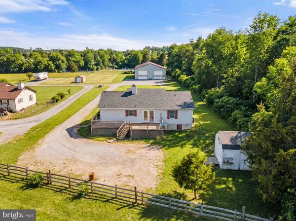an aerial view of a house with a lake view