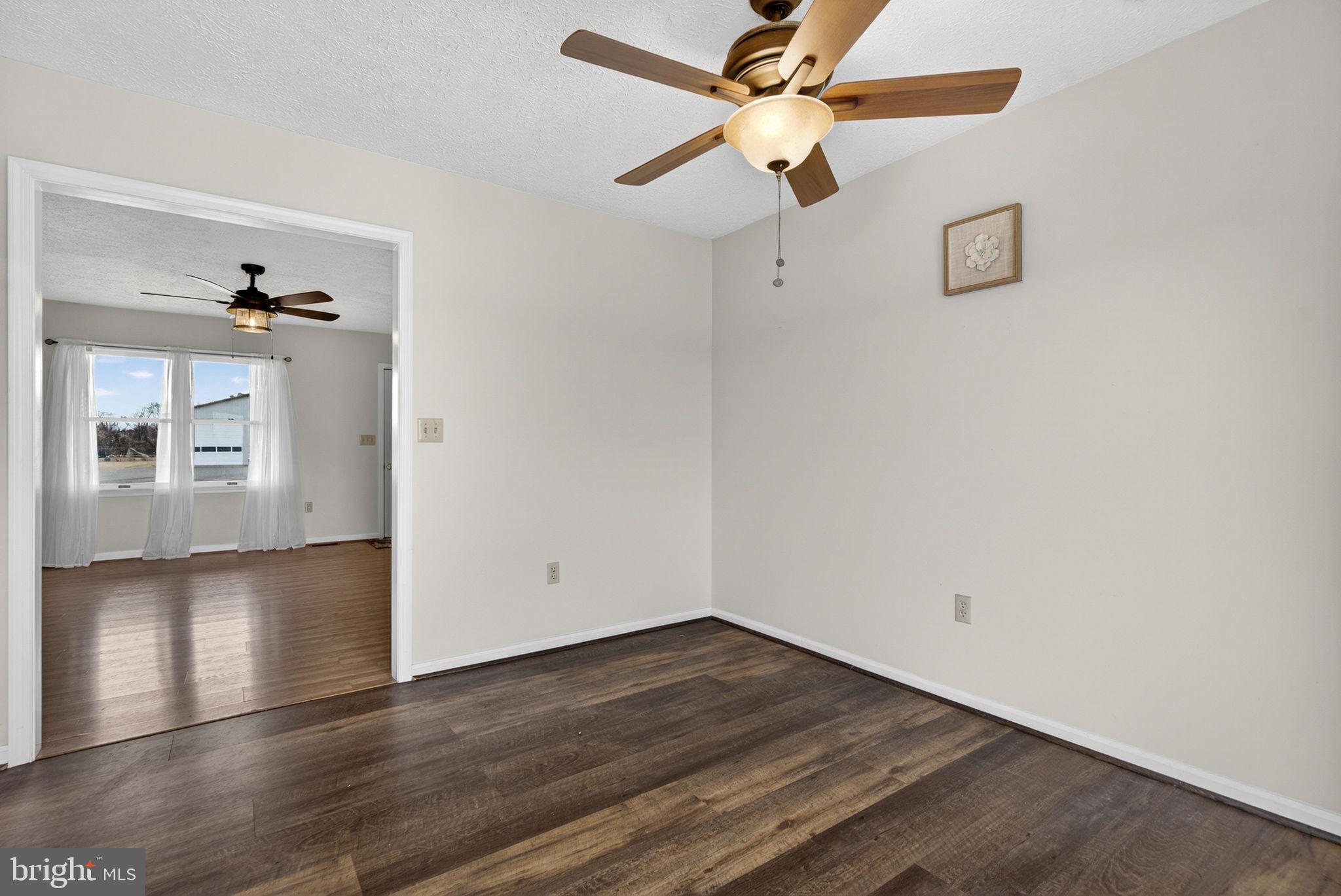 11576 Walters Road Orange, VA 22960 - Photo 19 of 61 an empty room with wooden floor closet and windows