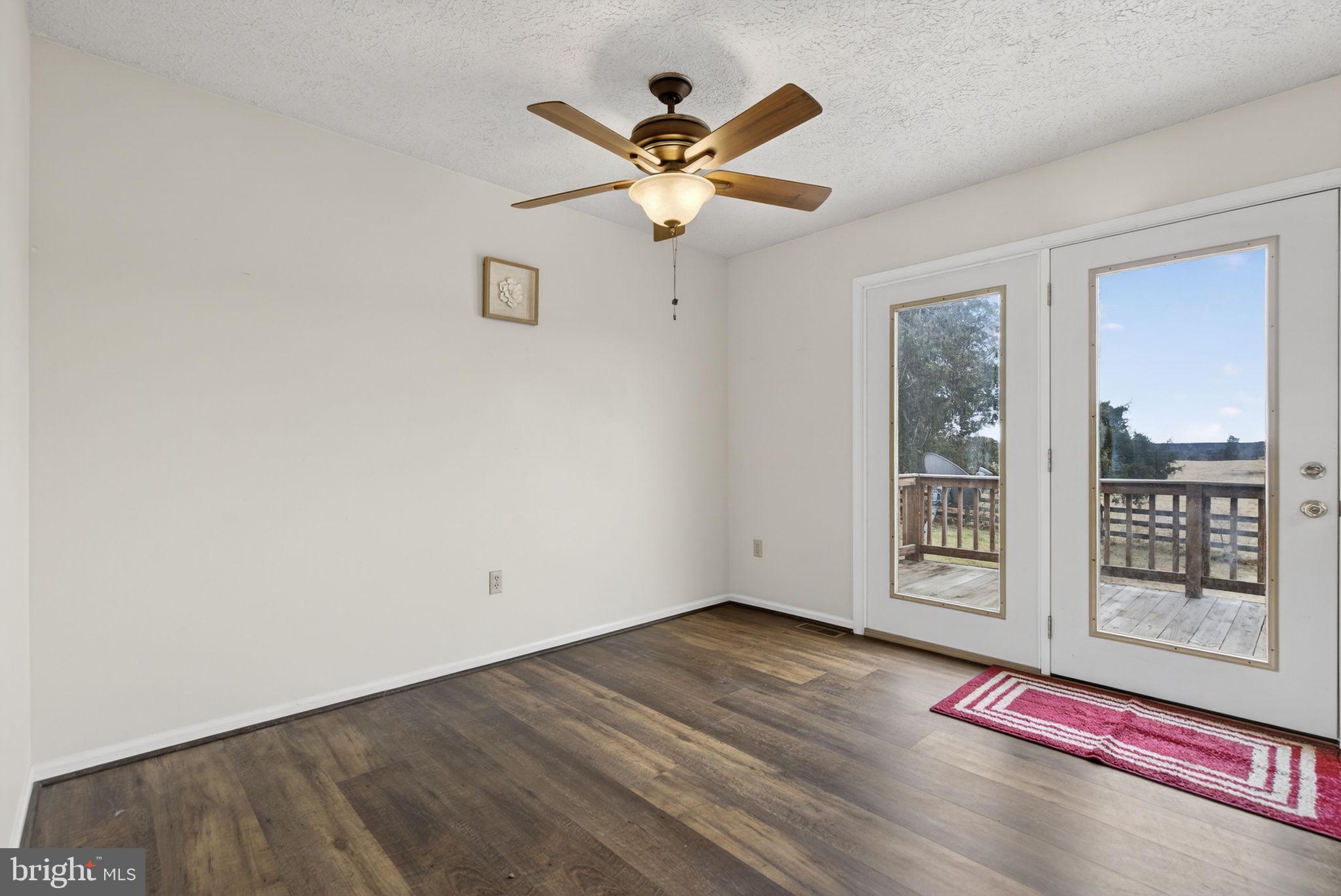 11576 Walters Road Orange, VA 22960 - Photo 20 of 61 a view of an empty room with window and ceiling fan