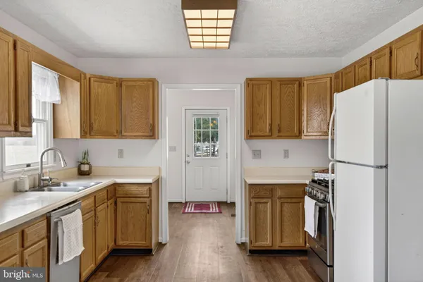 a view of an empty room and wooden floor