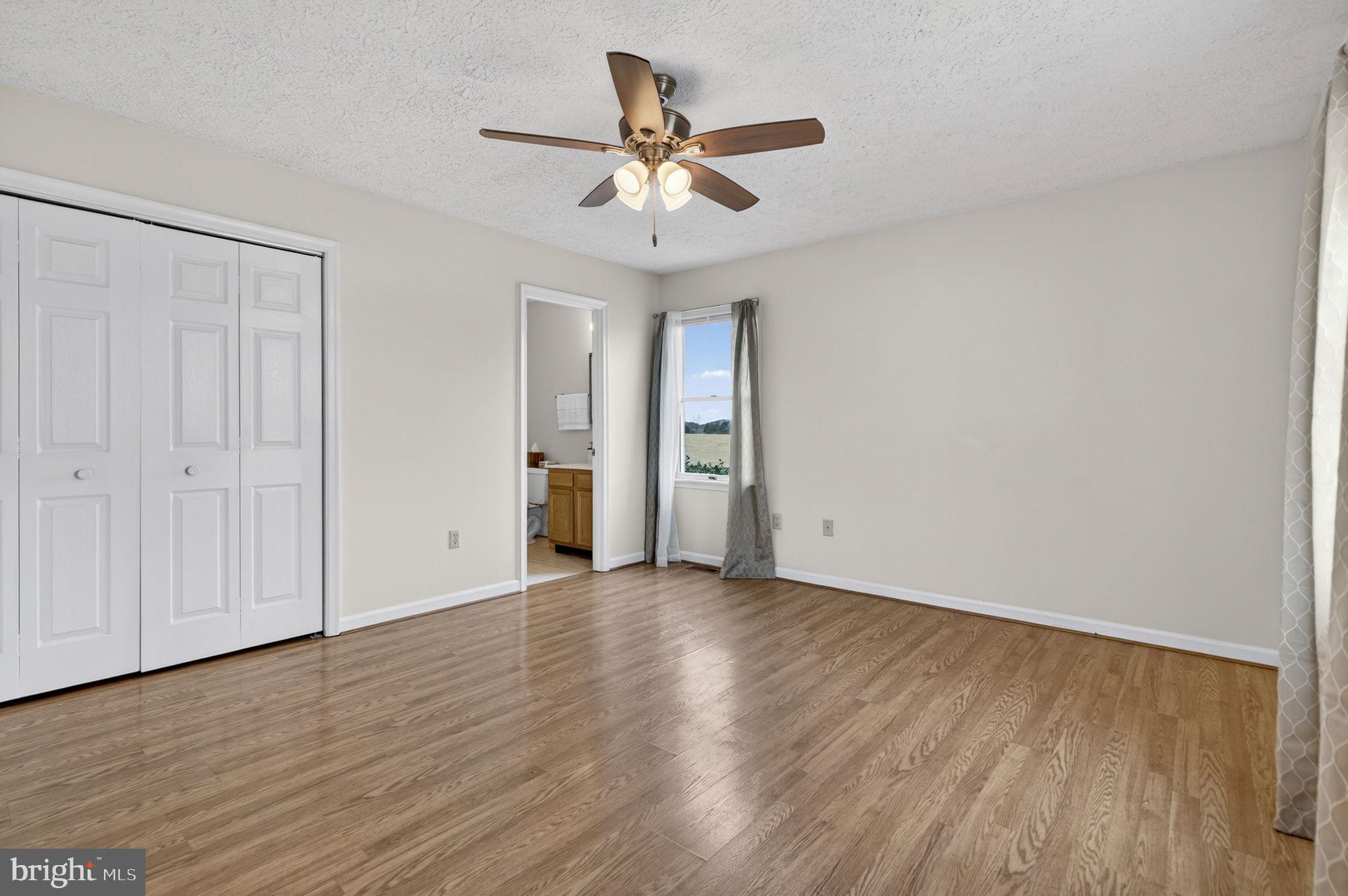 11576 Walters Road Orange, VA 22960 - Photo 29 of 61 a view of an empty room with wooden floor