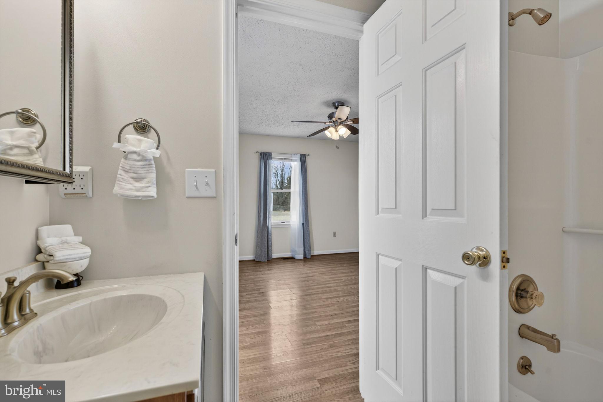 11576 Walters Road Orange, VA 22960 - Photo 30 of 61 a bathroom with a sink and mirror