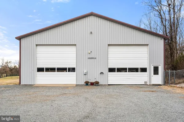 a view of parking garage with cars and other equipment