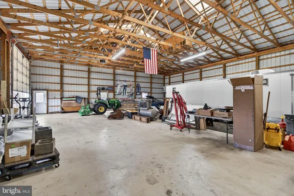 a bathroom with a sink toilet and a mirror