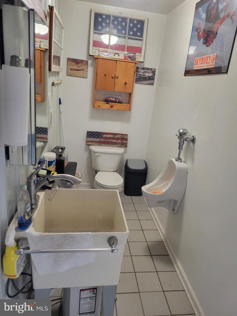 11576 Walters Road Orange, VA 22960 - Photo 48 of 61 a bath room with a sink and a mirror