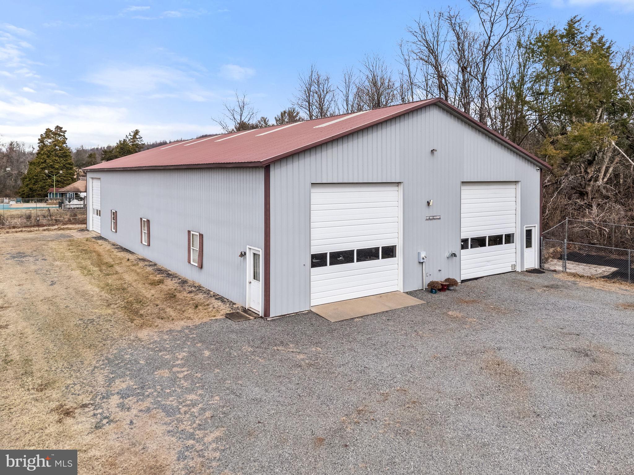 11576 Walters Road Orange, VA 22960 - Photo 49 of 61 a view of a house with a yard and garage