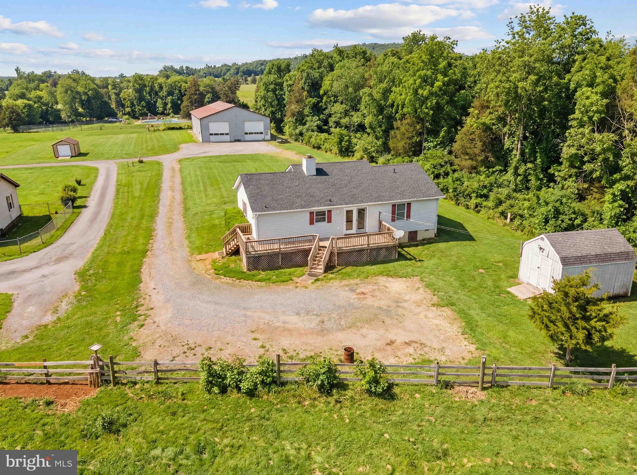 11576 Walters Road Orange, VA 22960 - Photo 10 of 61 an aerial view of a house with a big yard and large trees