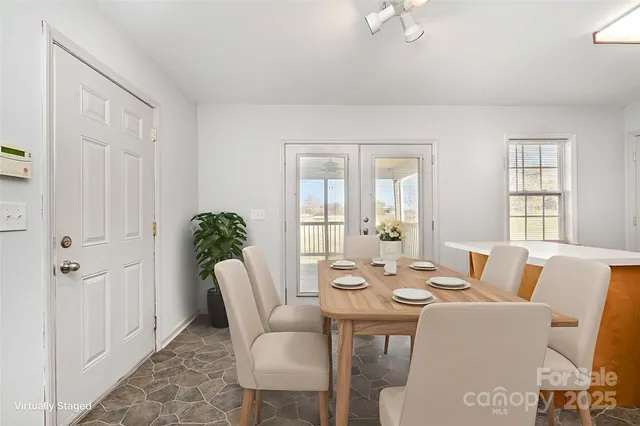 a dining room with furniture and window
