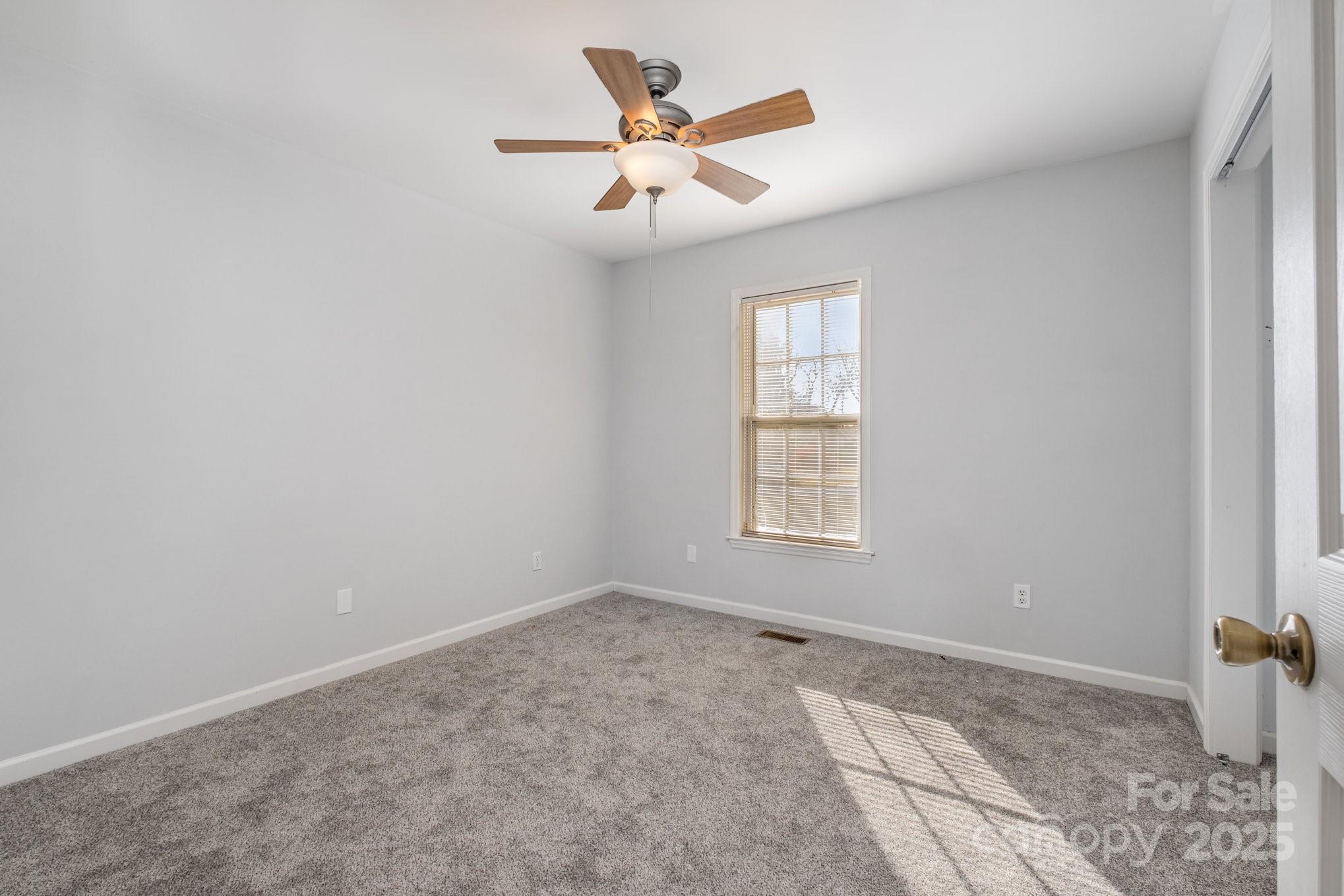 4980 Forest Ridge Drive Hickory, NC 28602 - Photo 22 of 35 an empty room with fan and windows
