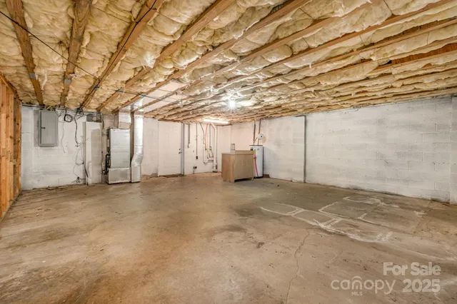a view of a parking space with wooden fence