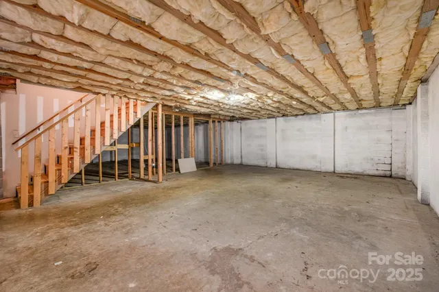 a view of an empty room with stairs