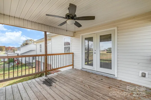 a view of a balcony with wooden floor