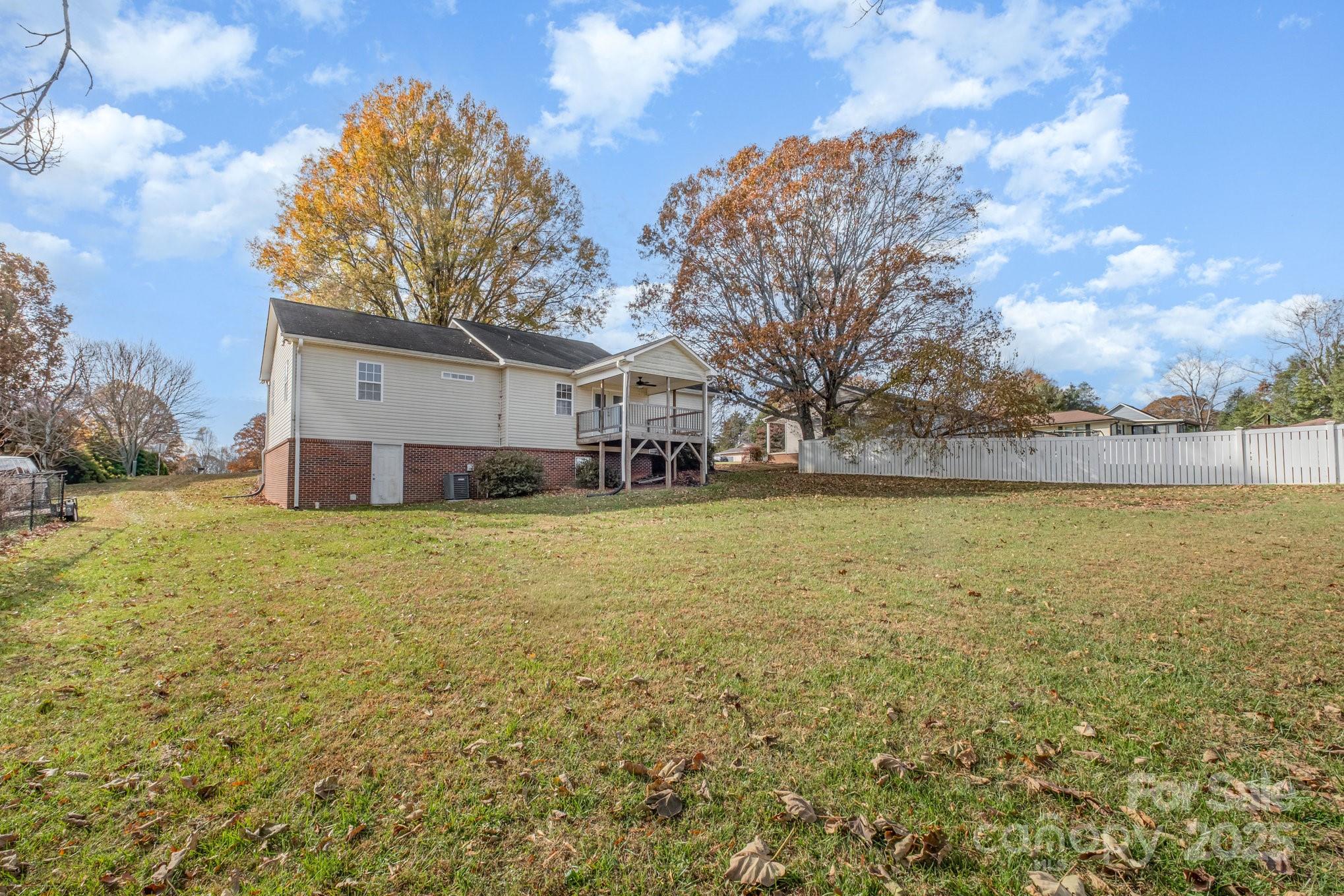 4980 Forest Ridge Drive Hickory, NC 28602 - Photo 34 of 35 a view of a lake with a house in the background