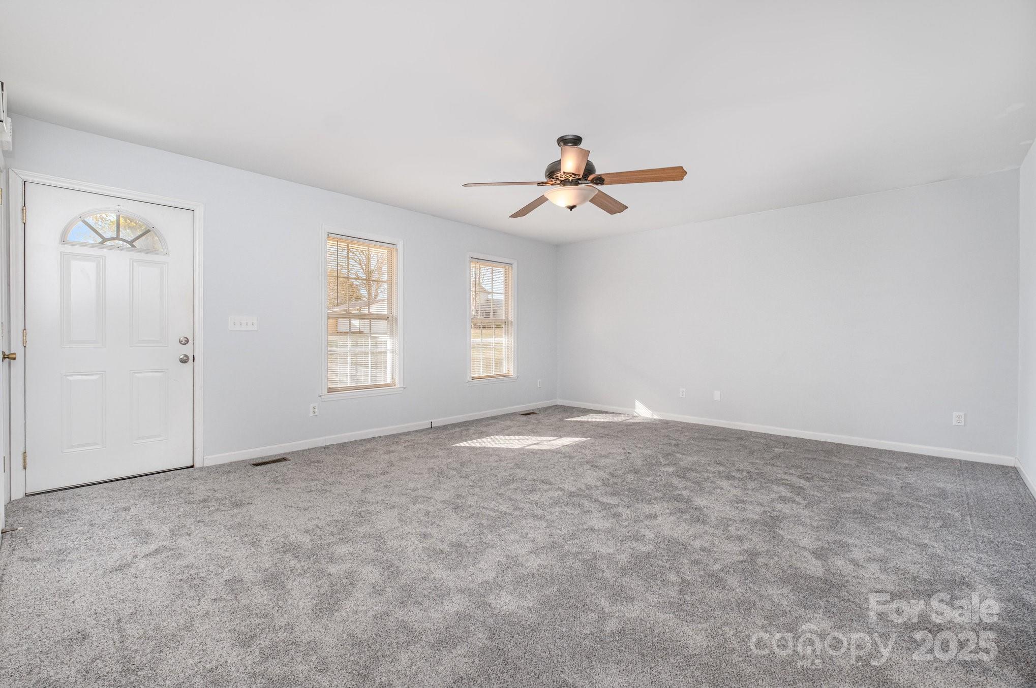 4980 Forest Ridge Drive Hickory, NC 28602 - Photo 9 of 35 wooden floor in an empty room with a window