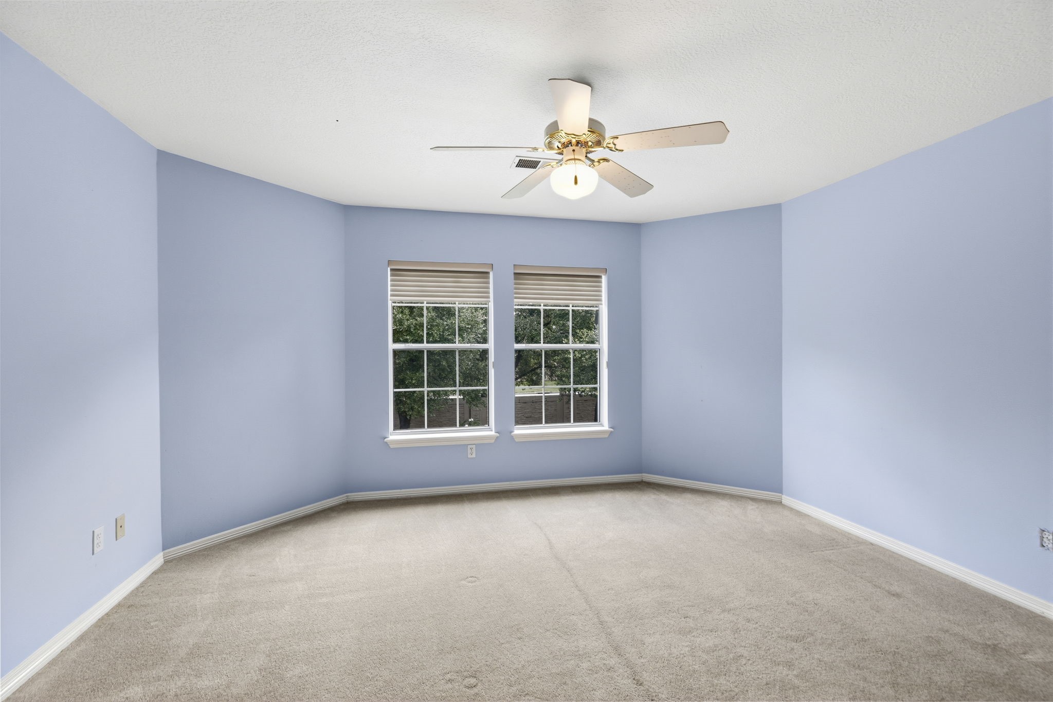 18310 Pamela Way Spring, TX 77379 - Photo 29 of 42 One of four spacious upstairs bedrooms featuring large windows that provide a serene view of the private backyard.