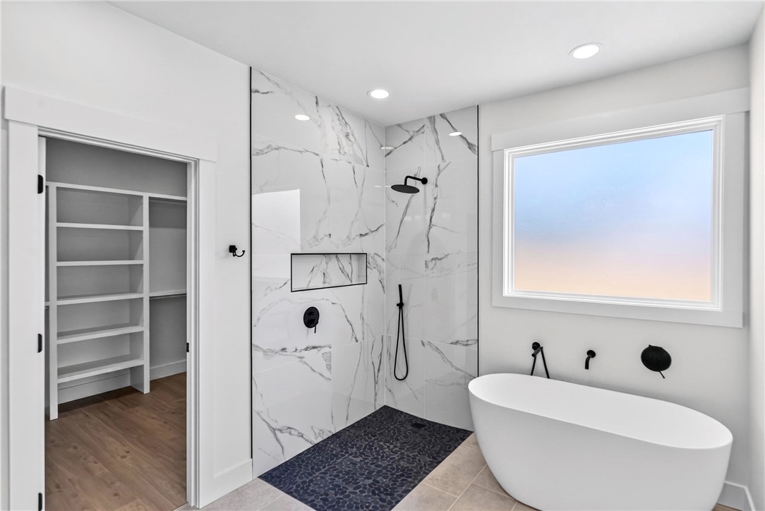 416 Blume Road Anderson, SC 29625 - Photo 22 of 29 Luxurious bathing quarters with a contemporary free-standing tub and a spacious walk-in shower.
