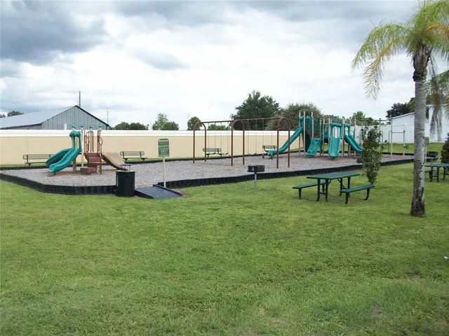 a view of a house with a backyard porch and sitting area