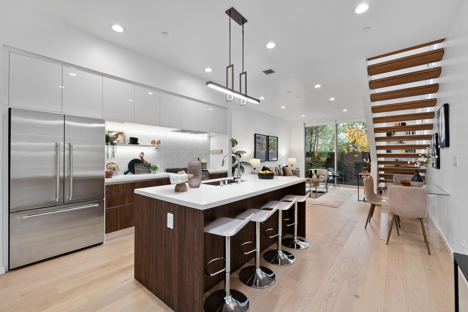 1034 Grayson Street Berkeley, CA 94710 - Photo 1 of 48 Kitchen featuring modern cabinets, built in refrigerator, white cabinets, a kitchen bar, and recessed lighting