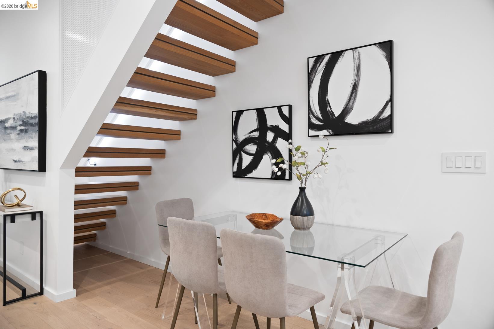 1034 Grayson Street Berkeley, CA 94710 - Photo 14 of 48 Dining area with wood finished floors and stairway