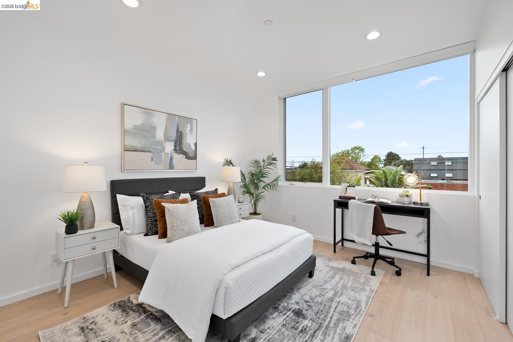 1034 Grayson Street Berkeley, CA 94710 - Photo 17 of 48 Bedroom with recessed lighting, light wood-type flooring, a closet, and a desk