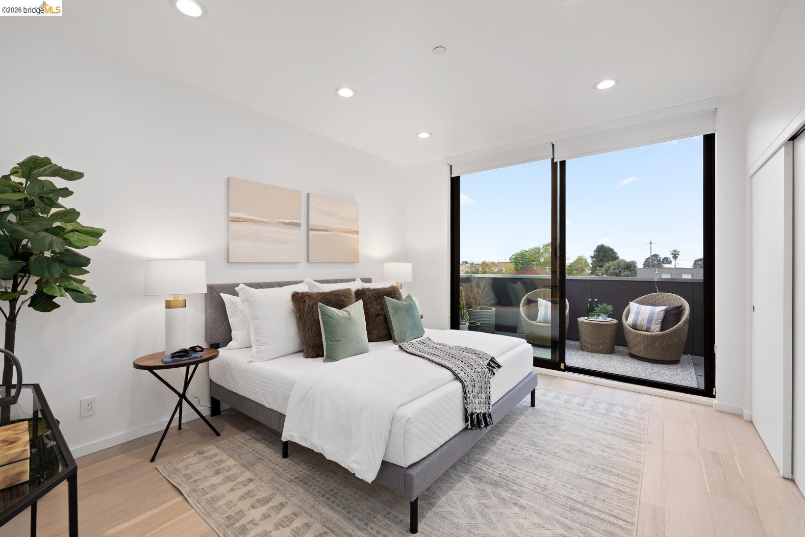 1034 Grayson Street Berkeley, CA 94710 - Photo 22 of 48 Bedroom with access to outside, recessed lighting, light wood finished floors, and a wall of windows