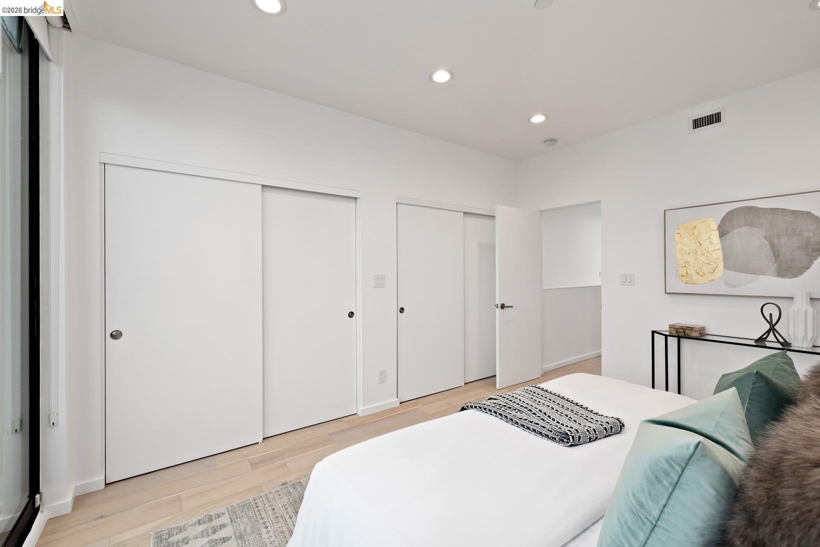 1034 Grayson Street Berkeley, CA 94710 - Photo 24 of 48 Bedroom with multiple closets, recessed lighting, and light wood-style floors