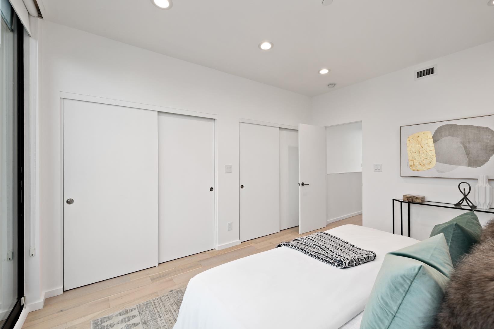 1034 Grayson Street Berkeley, CA 94710 - Photo 24 of 48 Bedroom with multiple closets, recessed lighting, and light wood-style floors