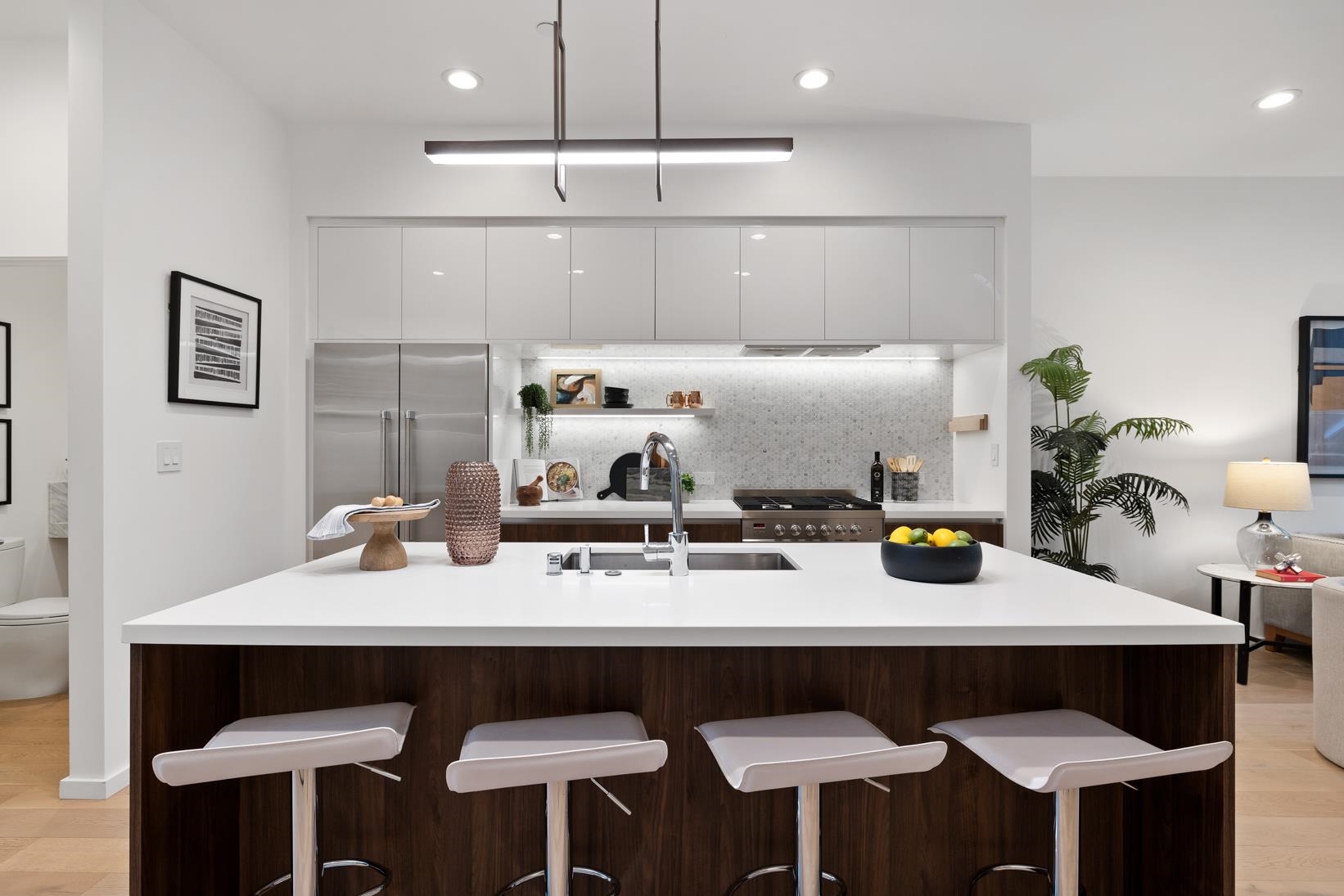 1034 Grayson Street Berkeley, CA 94710 - Photo 5 of 48 Kitchen featuring modern cabinets, open shelves, a breakfast bar, light wood-type flooring, and white cabinetry