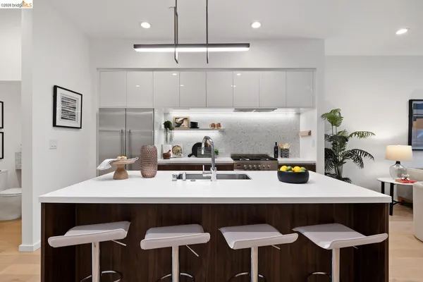 a kitchen with a dining table and chairs
