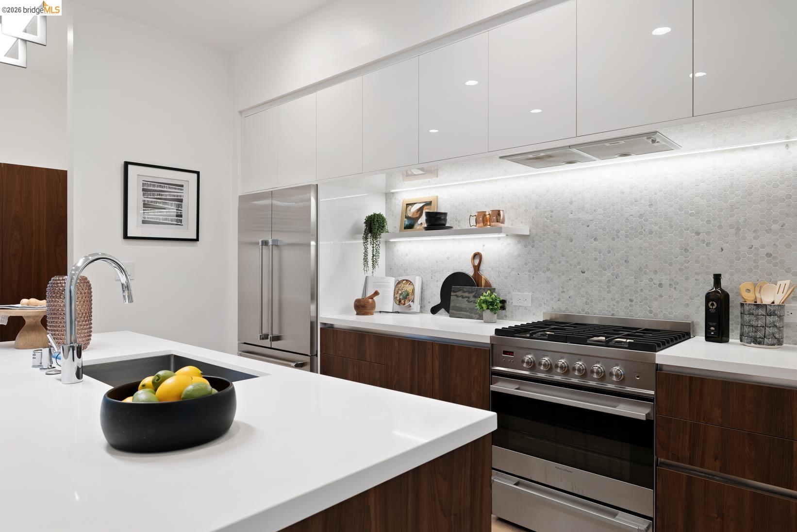 1034 Grayson Street Berkeley, CA 94710 - Photo 6 of 48 Kitchen featuring modern cabinets, appliances with stainless steel finishes, backsplash, open shelves, and white cabinetry
