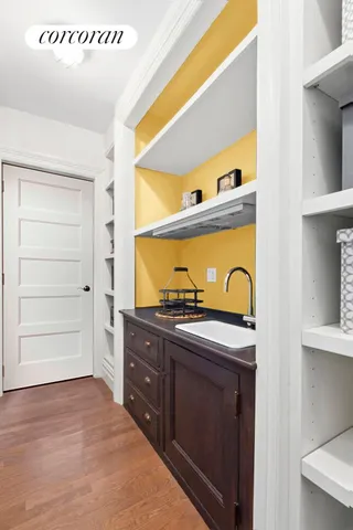 a kitchen with a stove a sink and a refrigerator