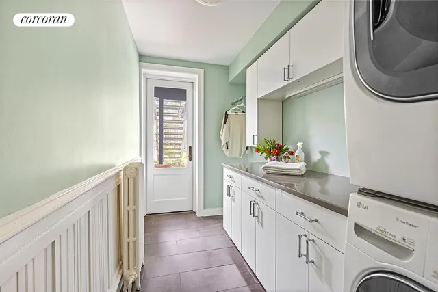 a spacious bathroom with a granite countertop sink and a mirror